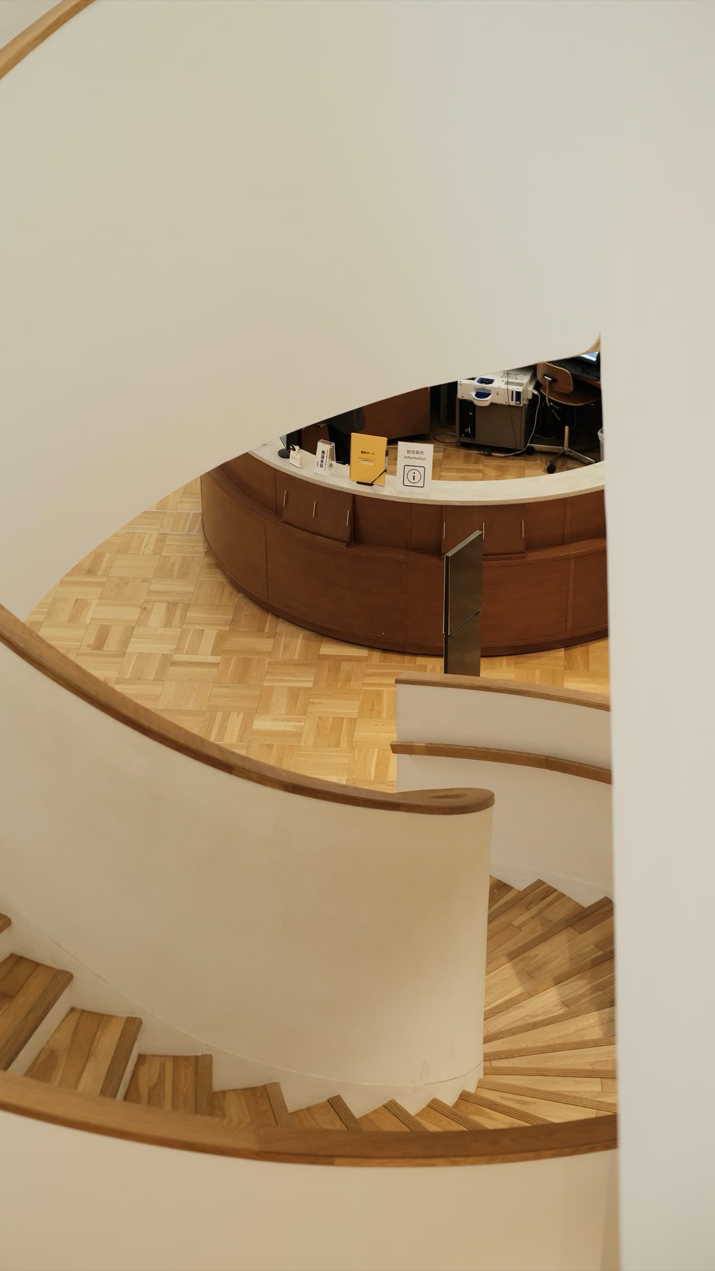 A curved staircase and timber floor in a Kyoto interior
