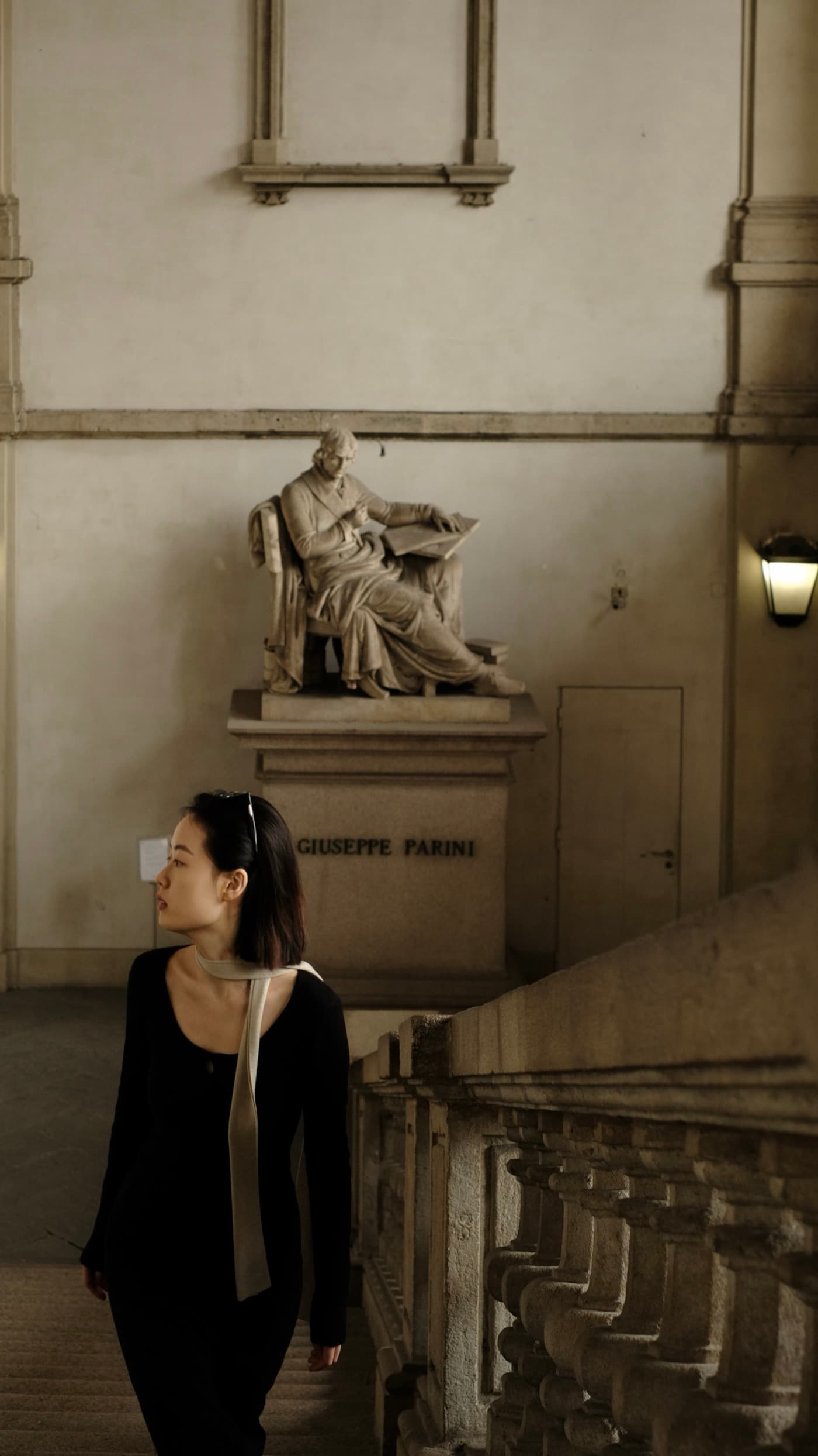 Wentian standing beside a sculpture at the Brera Academy